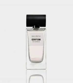 Clear glass perfume bottle of Genyum Ballerina with black cap, inspired by the grace of dance, showcasing the artistic fragrance collection.