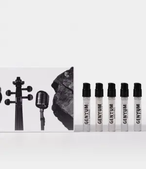 Genyum Discovery Set featuring various perfume samples on a light grey background, niche fragrance discovery kit for art lovers.